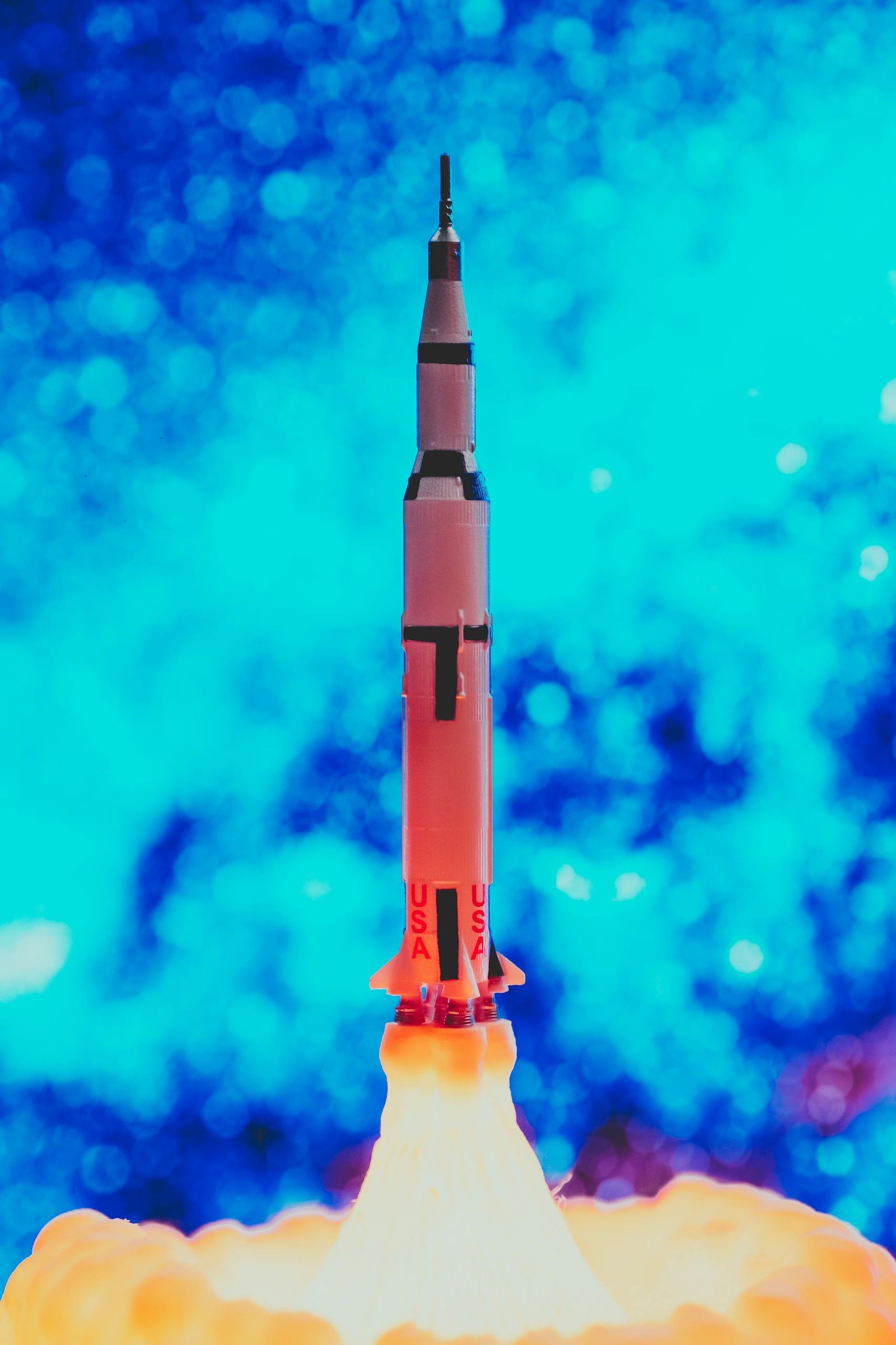 Illustration of a rocket launching with bright flames and blue background, emphasizing technology and innovation.